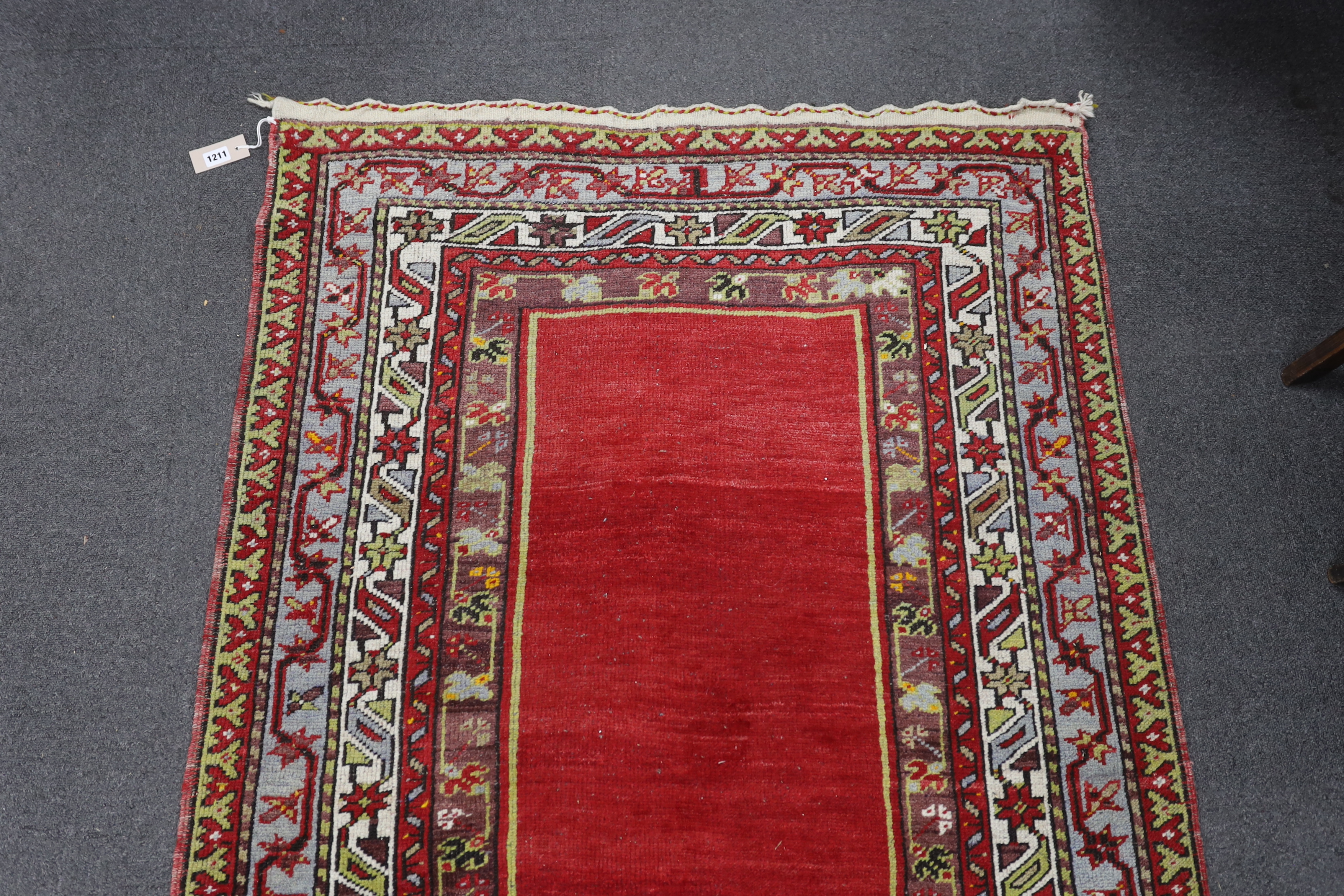 A Kesimuhsine Konya red ground prayer rug, 194 x 104cm